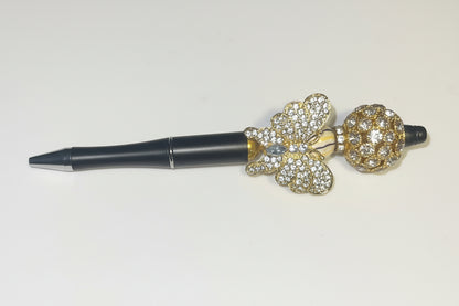 Handcrafted black pen with a large gold crystal butterfly charm by E-monae Jewels.