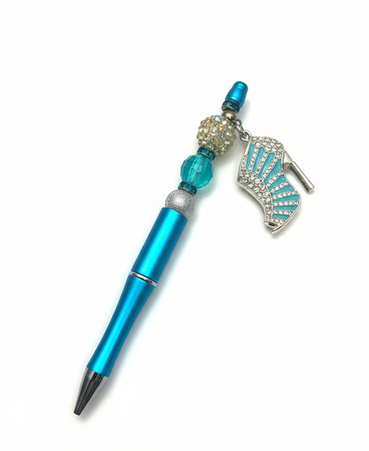 Handcrafted blue beaded pen with a teal crystal high-heel charm by E-monae Jewels.