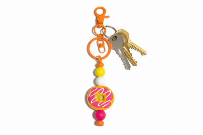 Colorful keychain with beads and a donut.