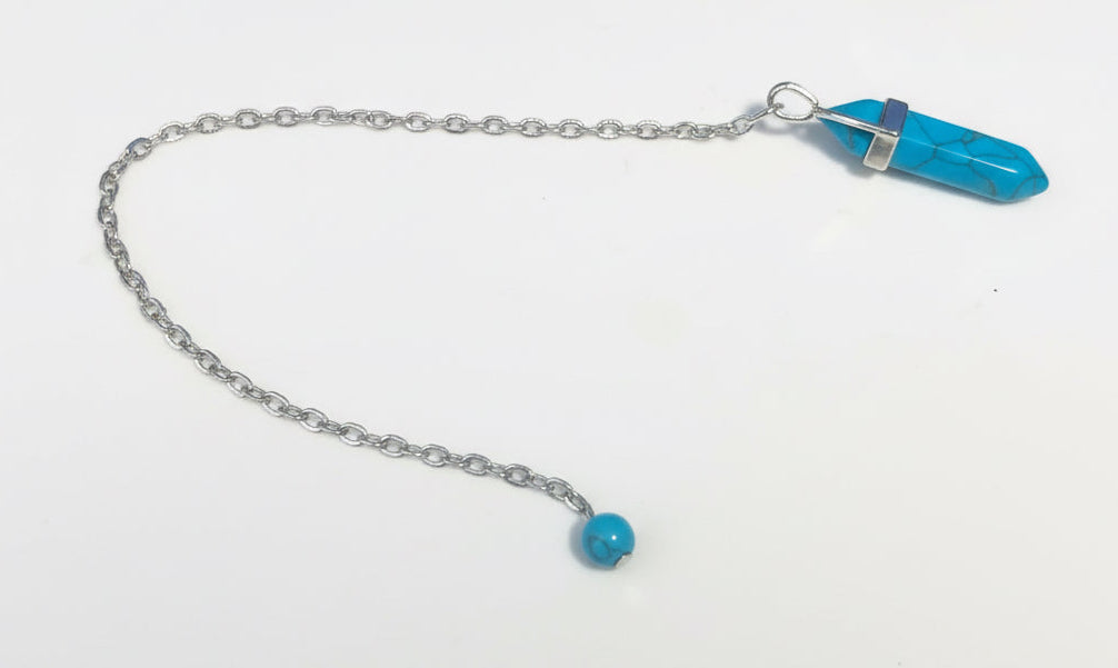 Blue Howlite pendant with chain Pendulum on a white background