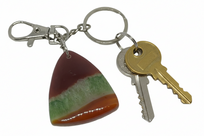Handcrafted triangular Ruby in Zoisite gemstone keychain featuring natural magenta and forest green patterns on a silver-toned keyring with keys.